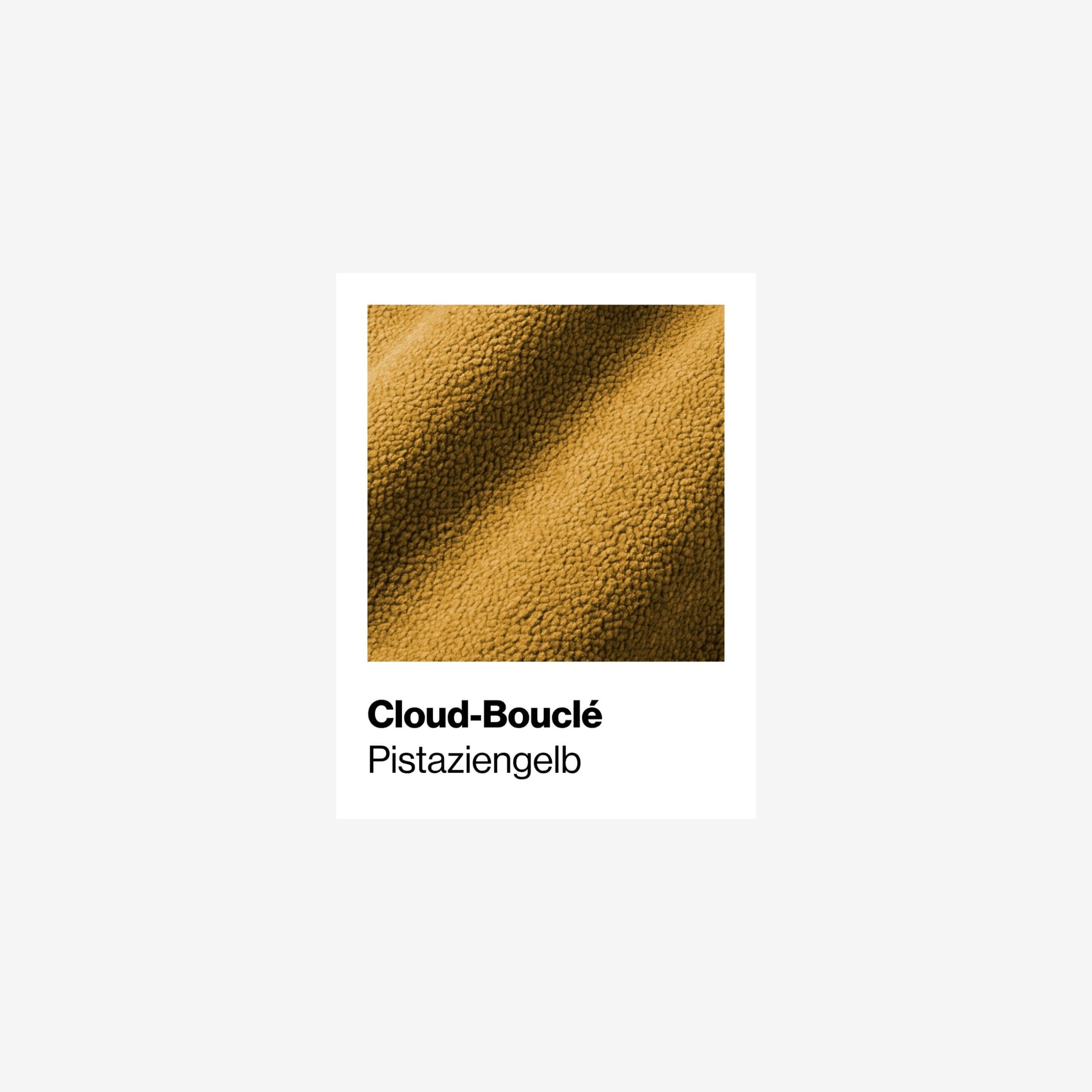 Nahaufnahme eines strukturierten gelb-grünen Stoffes mit der Aufschrift Cloud-Bouclé Pistaziengelb auf weißem Hintergrund.